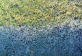 the grass is frozen over half the field