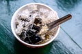 Grass Jelly in the bowl on green wooden table Royalty Free Stock Photo