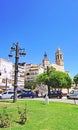 Grass roundabout and lampposts with the church of San Bartolome and Santa Tecla in the background, Sitges, Barcelona