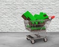 Grass and soil of puzzle pieces in shopping cart Royalty Free Stock Photo