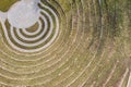 Grass and stone steps of outdoor amphitheater at sunny day. aerial view