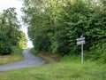 grass and trees in pays de laon with sign indicating miracles Royalty Free Stock Photo