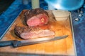 Grassfed prime roast beef on wooden cutting board