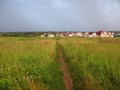 Grassland landscape with foot-path before storm