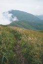 Grassland on mountain ridge covered in clouds on Wugong Mountain in Jiangxi, China Royalty Free Stock Photo