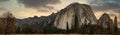 Grassland and rock mountain panorama with clouds