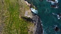 Grassy cliffs on the Atlantic coast. Landscape of Ireland from a height. Seaside rocks. Aerial photo Royalty Free Stock Photo