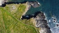 Grassy cliffs on the Atlantic Ocean coast. Landscape of Ireland from a height. Seaside rocks Royalty Free Stock Photo