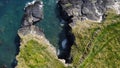 Grassy cliffs on the Atlantic Ocean coast. Landscape of Ireland from a height. Seaside rocks. Aerial photo. Drone point of view Royalty Free Stock Photo