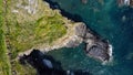 Grassy cliffs on the Atlantic Ocean coast. Landscape of Ireland from a height. Seaside rocks. Aerial photo. View from above Royalty Free Stock Photo