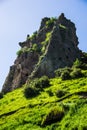 Grassy hill, cave city vertical Royalty Free Stock Photo