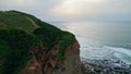 Grassy hill ocean side drone view. Gloomy sea beach cliff nature slow motion Royalty Free Stock Photo