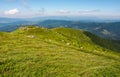 Grassy hillside with huge boulders Royalty Free Stock Photo