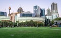 Grassy place at Tumbalong park at dusk with Sydney skyline in background in Darling Harbour NSW Australia Royalty Free Stock Photo