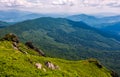 Grassy slope with huge boulders Royalty Free Stock Photo