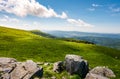 Grassy slopes with huge rocks Royalty Free Stock Photo