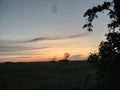 Grassy sunset in Oklahoma clouds tress Royalty Free Stock Photo
