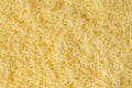 Grated cheese background texture. yellow shredded  cheese. Close up top view Royalty Free Stock Photo