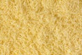 Grated cheese background texture. yellow shredded  cheese. Close up top view Royalty Free Stock Photo