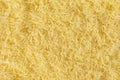 Grated cheese background texture. yellow shredded  cheese. Close up top view Royalty Free Stock Photo