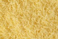 Grated cheese background texture. yellow shredded  cheese. Close up top view Royalty Free Stock Photo