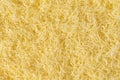 Grated cheese background texture. yellow shredded  cheese. Close up top view Royalty Free Stock Photo