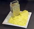 Grated cheese and grater Royalty Free Stock Photo