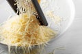 Grated cheese and grater Royalty Free Stock Photo