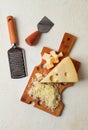 Grated cheese, Maasdam, on a cutting board, grater and cheese knife, close-up, no people,