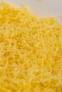 grated cheese of orange color, grated cheese preparation for adding to Royalty Free Stock Photo
