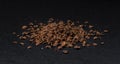 Grated chocolate. Heap of ground chocolate isolated on black background, closeup Royalty Free Stock Photo