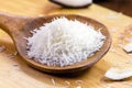 Grated coconut wooden spoon, coconut-based ingredient