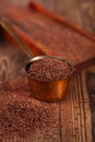 Grated dark chocolate in copper measure pan Royalty Free Stock Photo