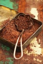 Grated dark chocolate in vintage tin