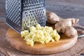 Grated ginger root on a cutting board Royalty Free Stock Photo