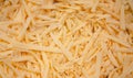 Grated hard cheese for homemade pizza. Russian, Dutch cheese. Grated cheese in macro