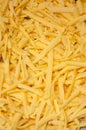 Grated hard cheese for homemade pizza. Russian, Dutch cheese. Grated cheese in macro