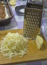 Grated hard cheese in the kitchen
