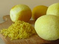 Grated lemon skin. Finely grate lemon zest. Juicy ripe yellow lemons.