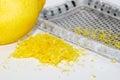 Grated lemon zest with the fruit and grater Royalty Free Stock Photo