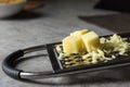 Grated Parmesan cheese, Cheese grater with cheddar Royalty Free Stock Photo