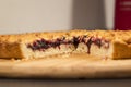 Grated pie with jam and cut a piece