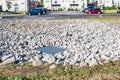 Grated storm drain inlet surrounded by rock for soil erosion control Royalty Free Stock Photo