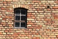 Grated window in wall of bricks Royalty Free Stock Photo