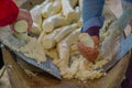 Grated yucca being prepared for bread in a Siona village in the Cuyabeno Wildlife Reserve, Ecuador