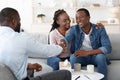 Grateful Black Spouses Shaking Hands With Counselor After Successful Marital Therapy Royalty Free Stock Photo