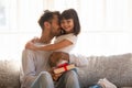 Grateful dad hugging daughter thanking for gift on fathers day