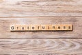 Gratefulness word written on wood block. gratefulness text on wooden table for your desing, concept Royalty Free Stock Photo