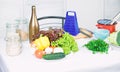 Grater and bottle near vegetables. Vegetables easy meal. Healthy dish. Greenery lettuce cabbage broccoli fresh