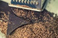 Grater and grated chocolate closeup